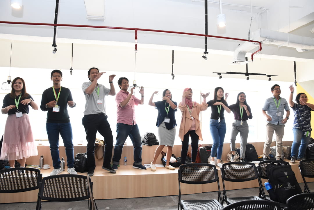 Learning makes your mind—and body—move! Participants who lost in a group activity had to perform a fun dance routine for their peers