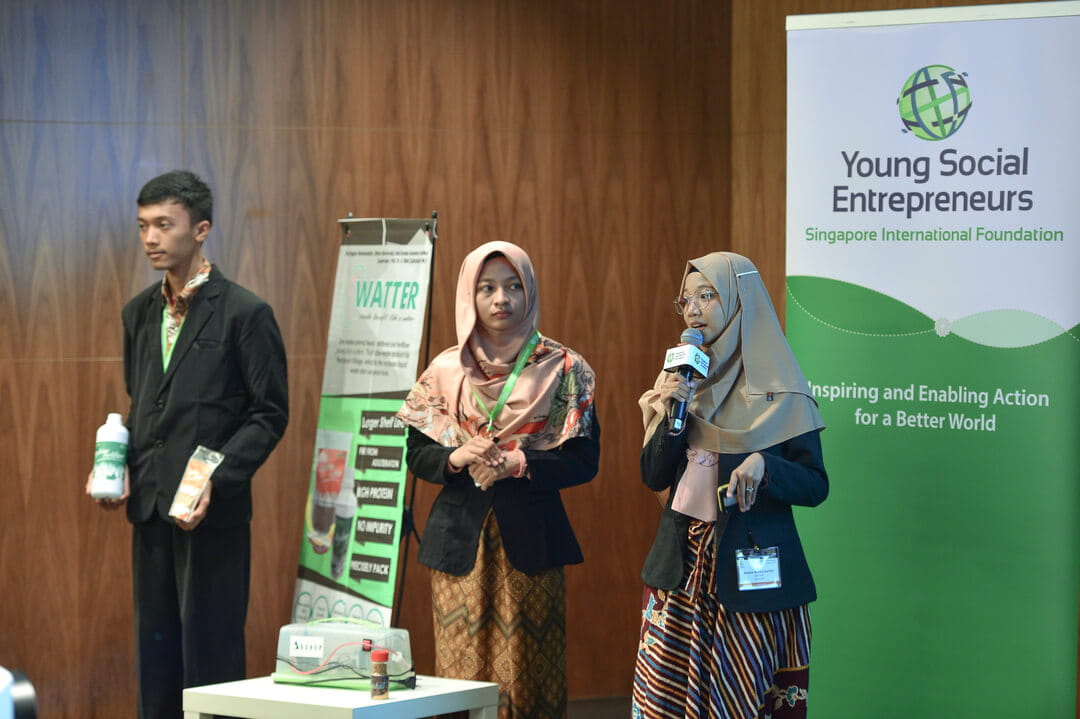 Indonesian participants (from left) Bagas Rohmatulloh, Ulfatu Mahmudda and Aurora Kartika from WATTER describe how the zero-waste animal feed and fertilizer they produce from soybean waste helps to increase farm yield at lower costs