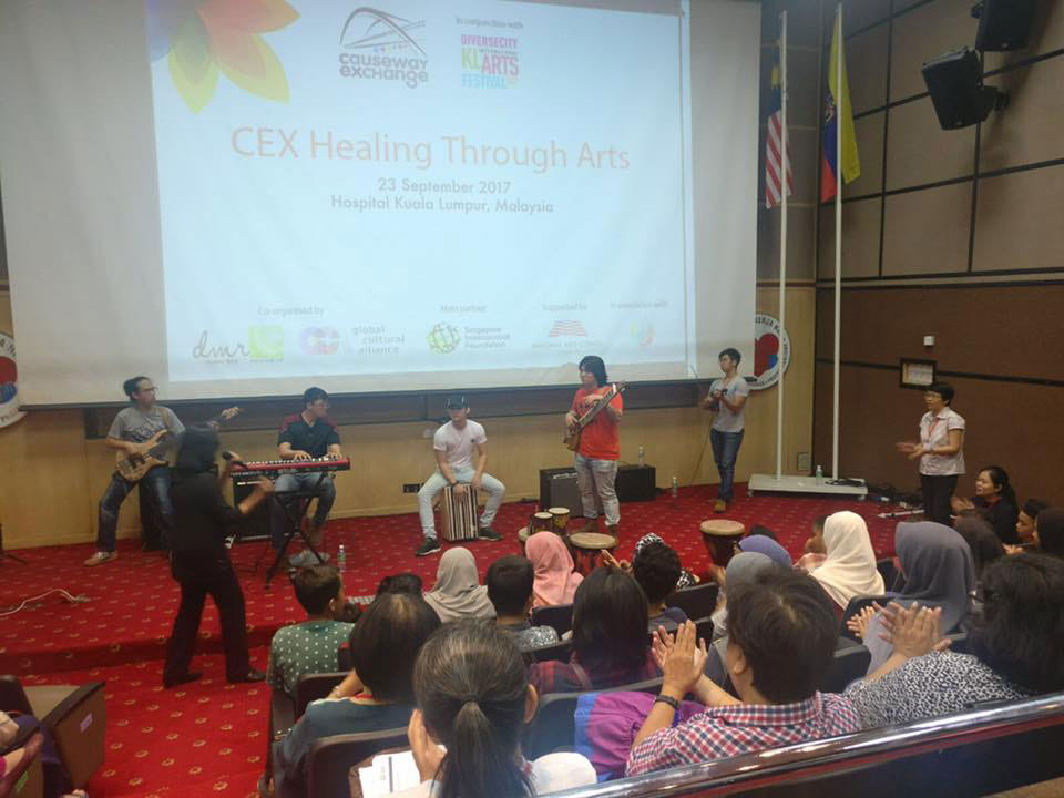 Singaporean world fusion music group Flame of the Forest leading a session on engagement through music during the CausewayEXchange Arts and Healing
