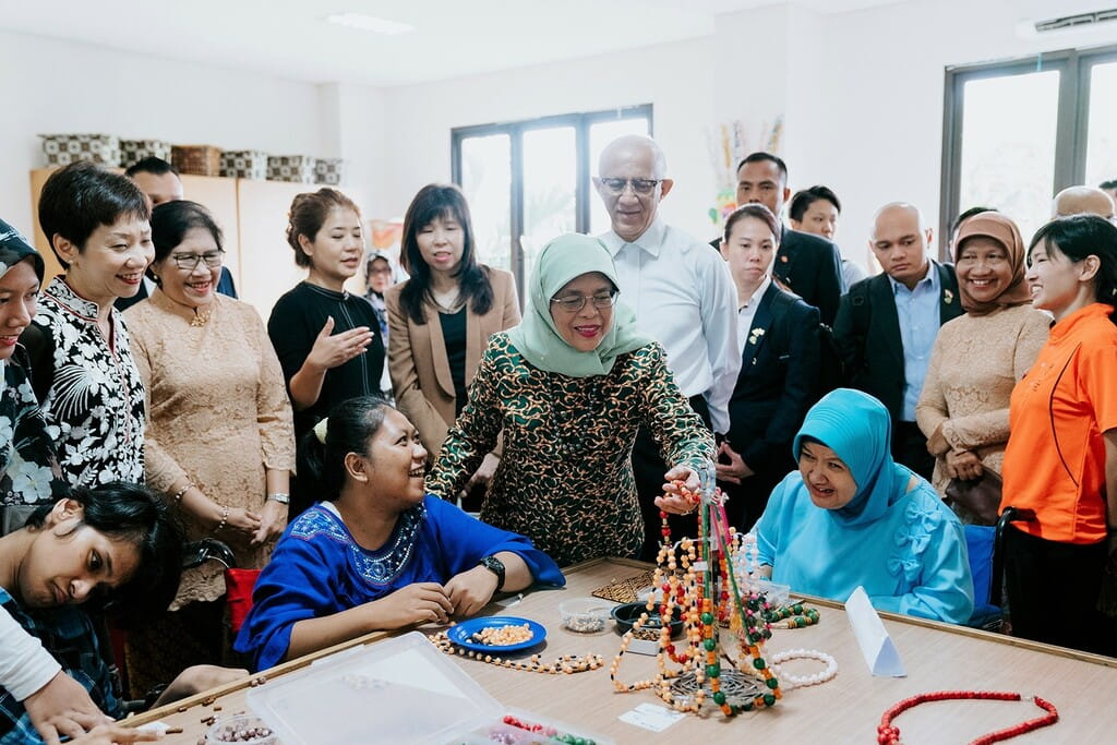 ingapore President Halimah Yacob (centre) and Minister for Culture, Community and Youth, Ms Grace Fu (standing, left) together with other Singapore dignitaries