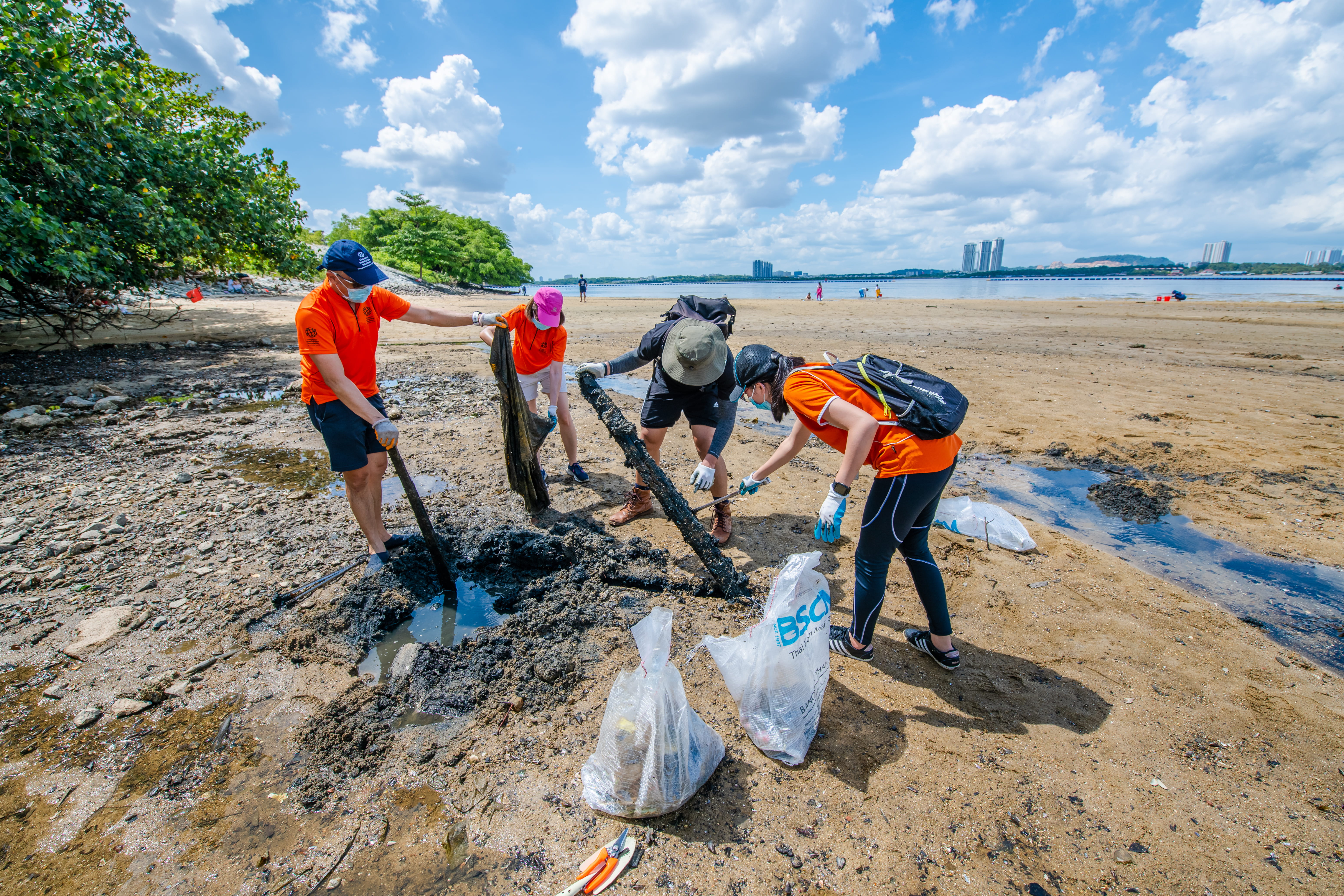 Volunteers from the SIF Community Clean Up the Beach to Mark World Water Day